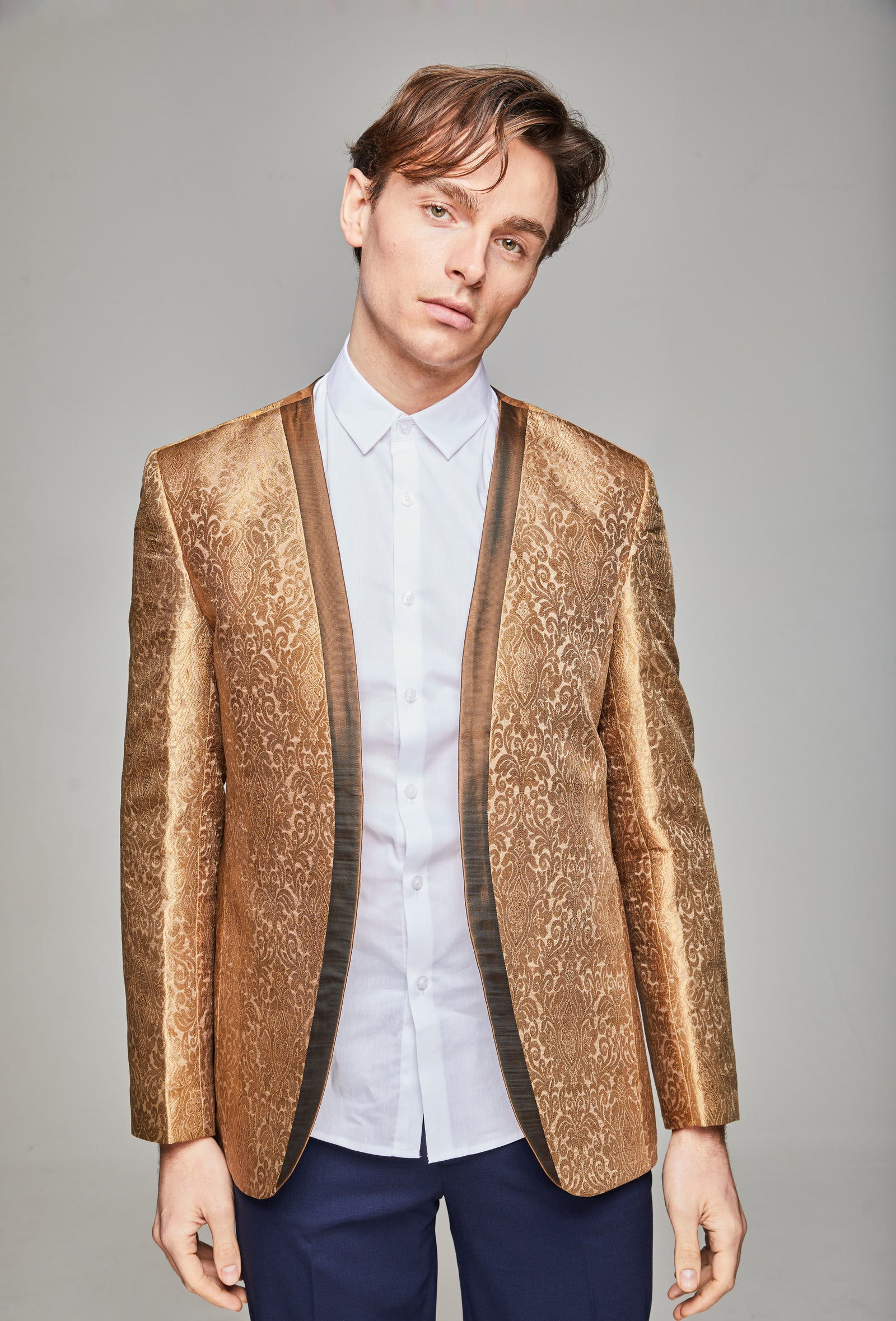 Front model shot wearing Firawn men's collarless, embroidered zari thread blazer with contrasting trim in Antique Gold